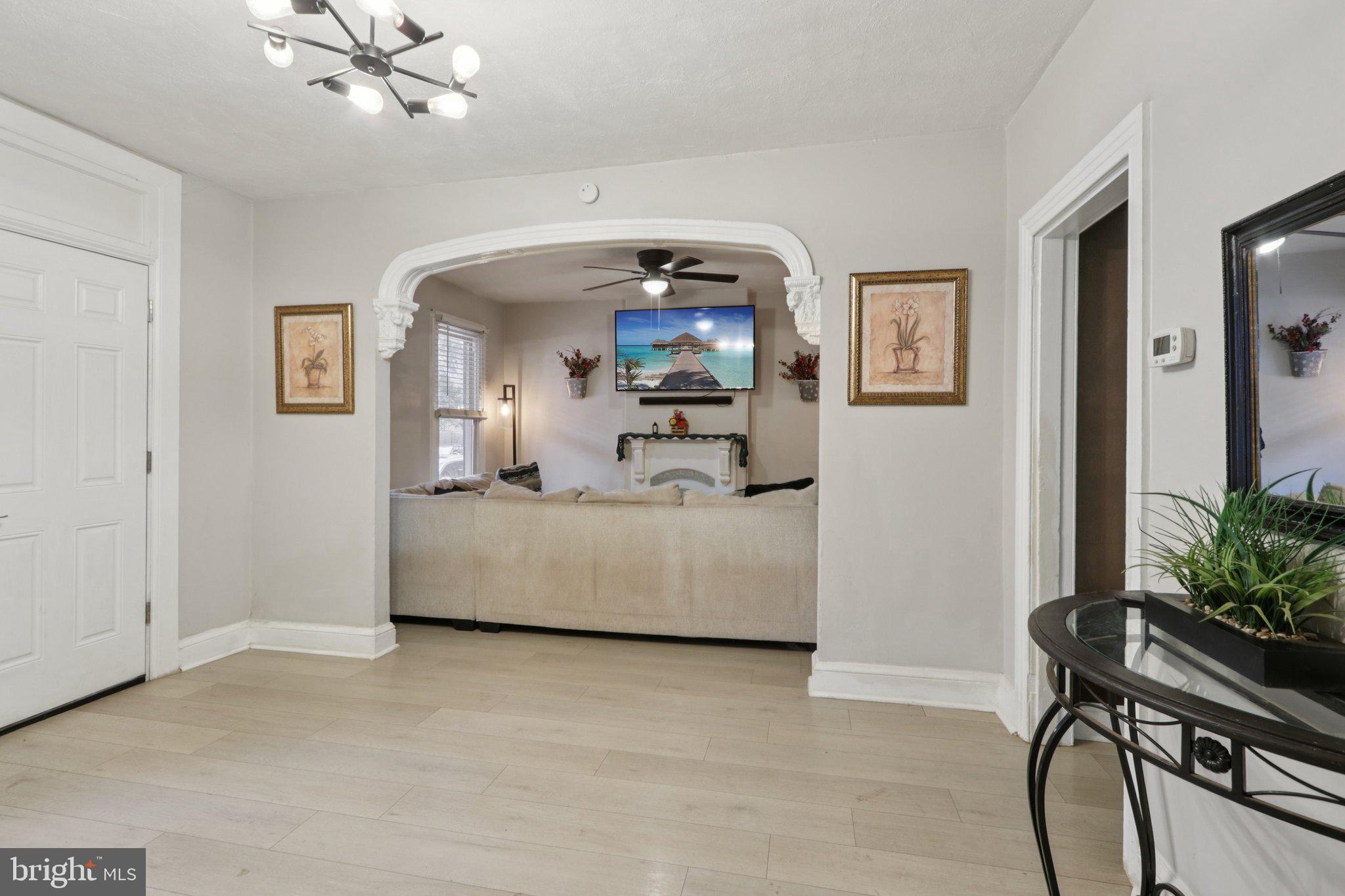 418 Walnut Street Pottstown, PA 19464 - Photo 13 of 52 a living room with furniture and a chandelier