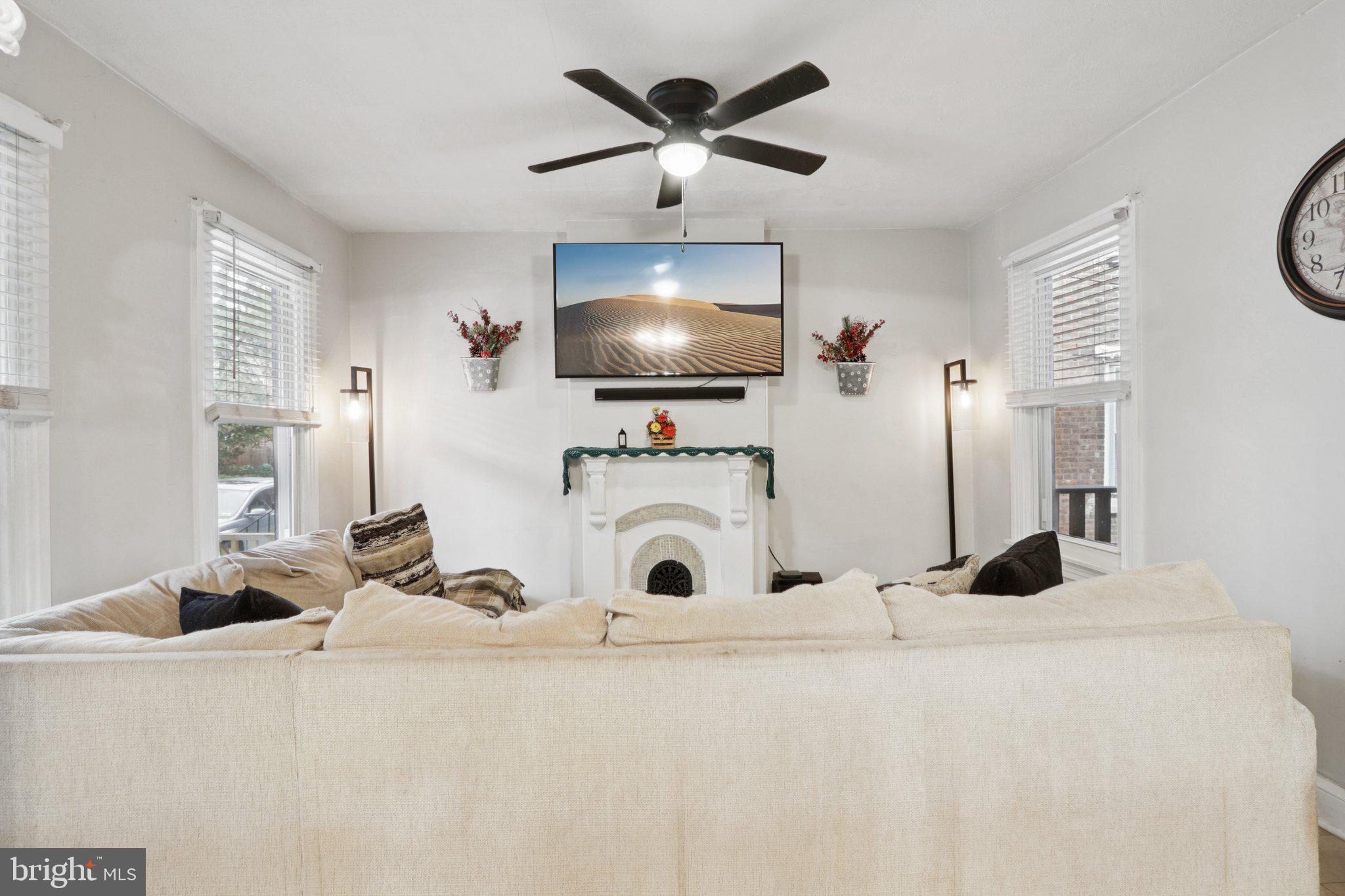 418 Walnut Street Pottstown, PA 19464 - Photo 15 of 52 a living room with furniture and a flat screen tv