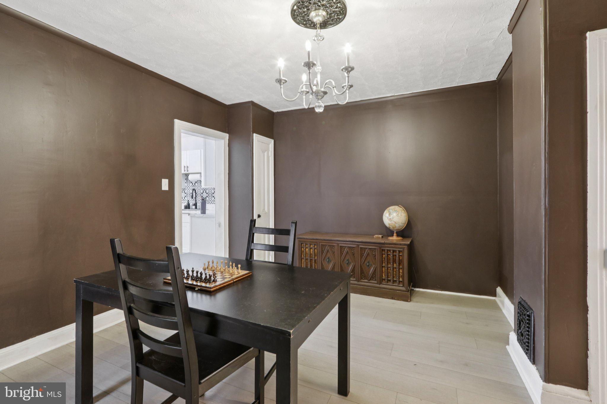 418 Walnut Street Pottstown, PA 19464 - Photo 21 of 52 a view of a dining room with furniture and chandelier