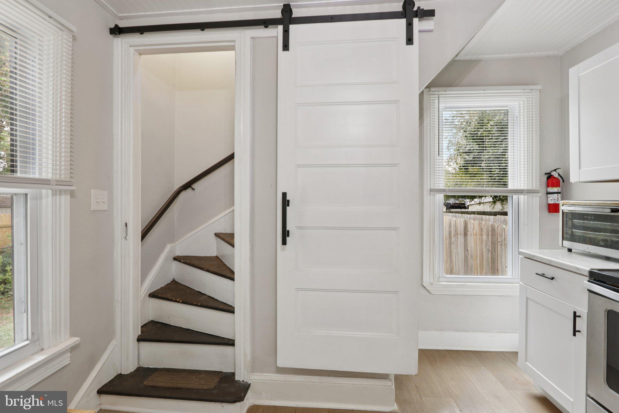 418 Walnut Street Pottstown, PA 19464 - Photo 22 of 52 a view of a kitchen with a white cabinet and a window