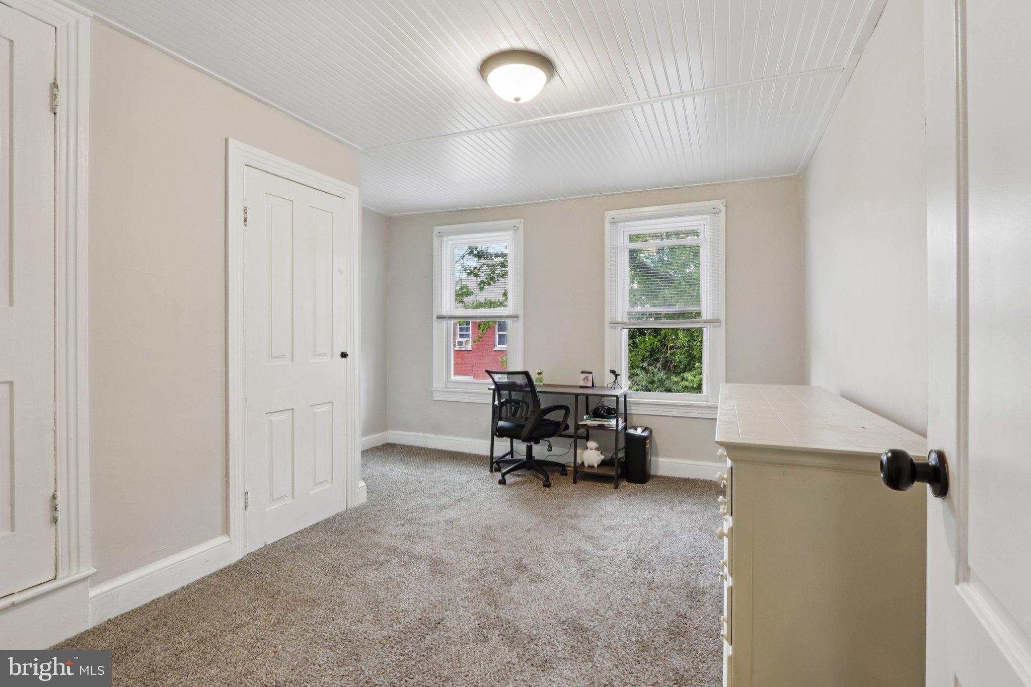 418 Walnut Street Pottstown, PA 19464 - Photo 28 of 52 a living room with furniture and a window