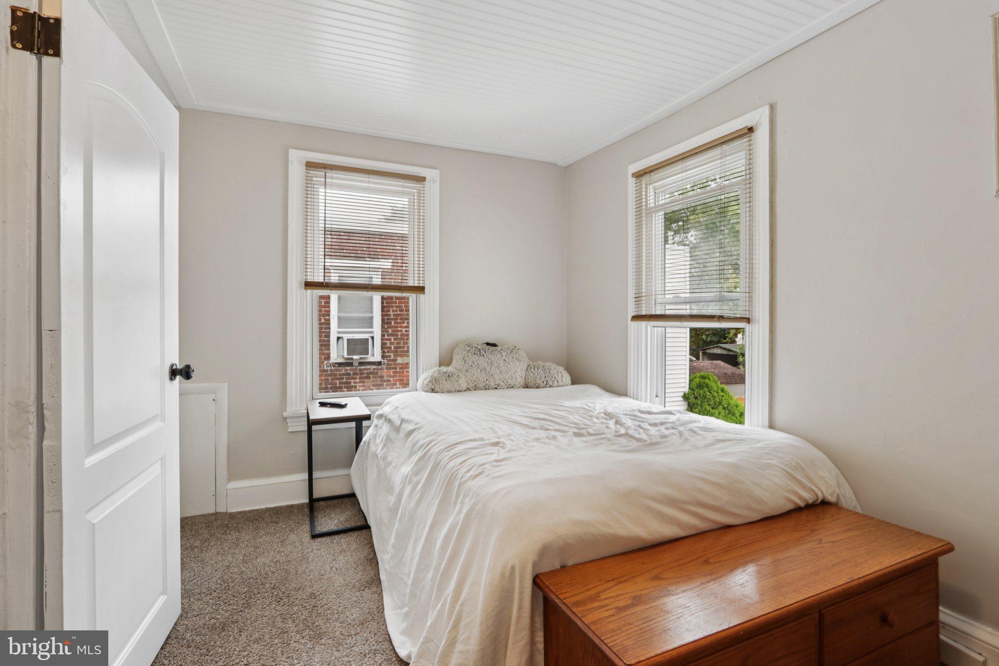 418 Walnut Street Pottstown, PA 19464 - Photo 29 of 52 a bed sitting in a bedroom next to a window