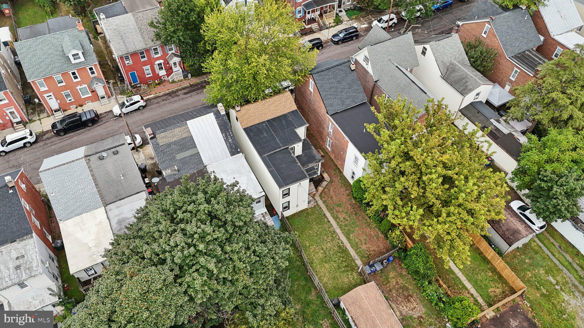 418 Walnut Street Pottstown, PA 19464 - Photo 39 of 52 an aerial view of a house with a yard and garden