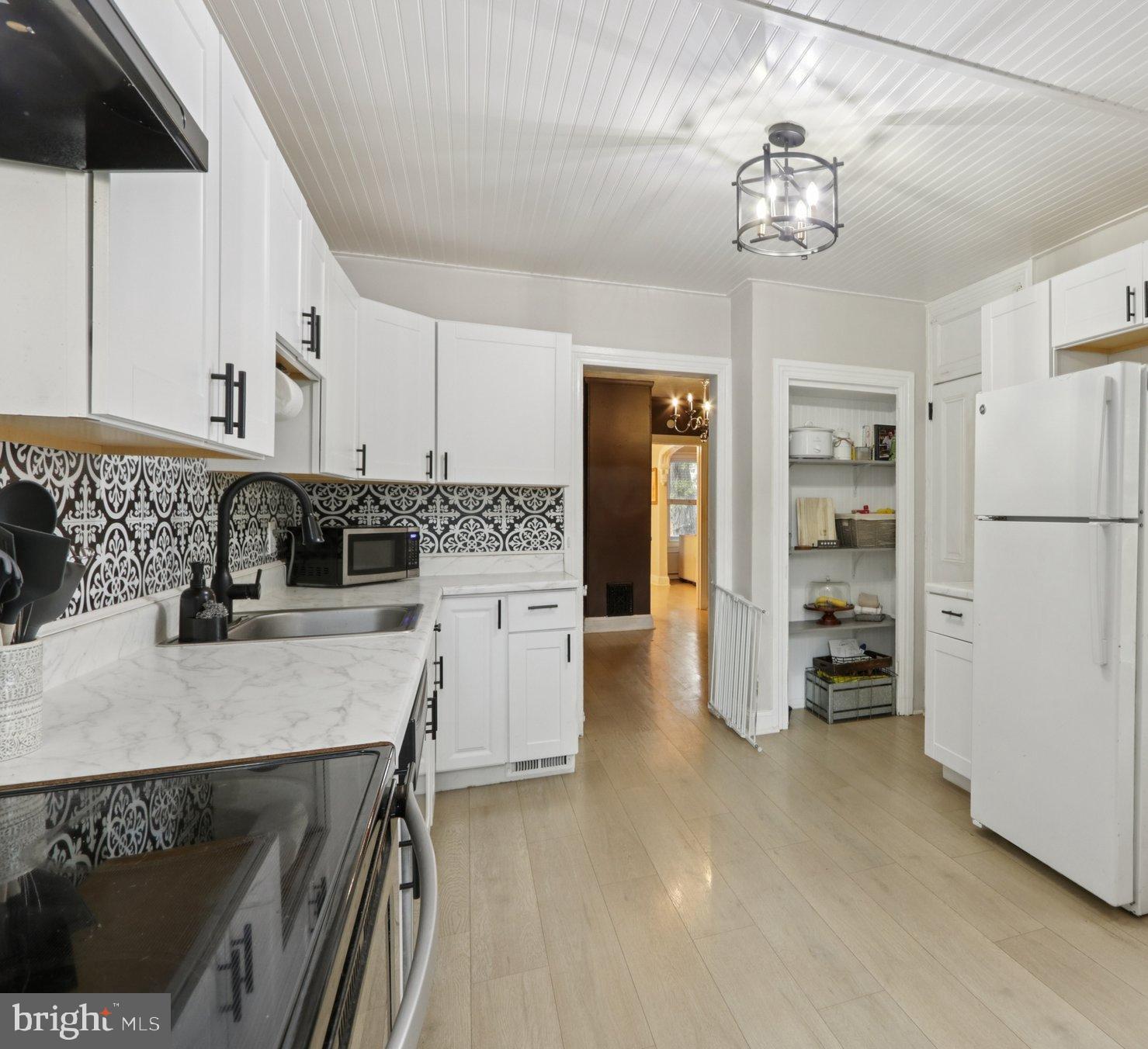 418 Walnut Street Pottstown, PA 19464 - Photo 5 of 52 a kitchen with stainless steel appliances granite countertop a refrigerator a stove and a sink