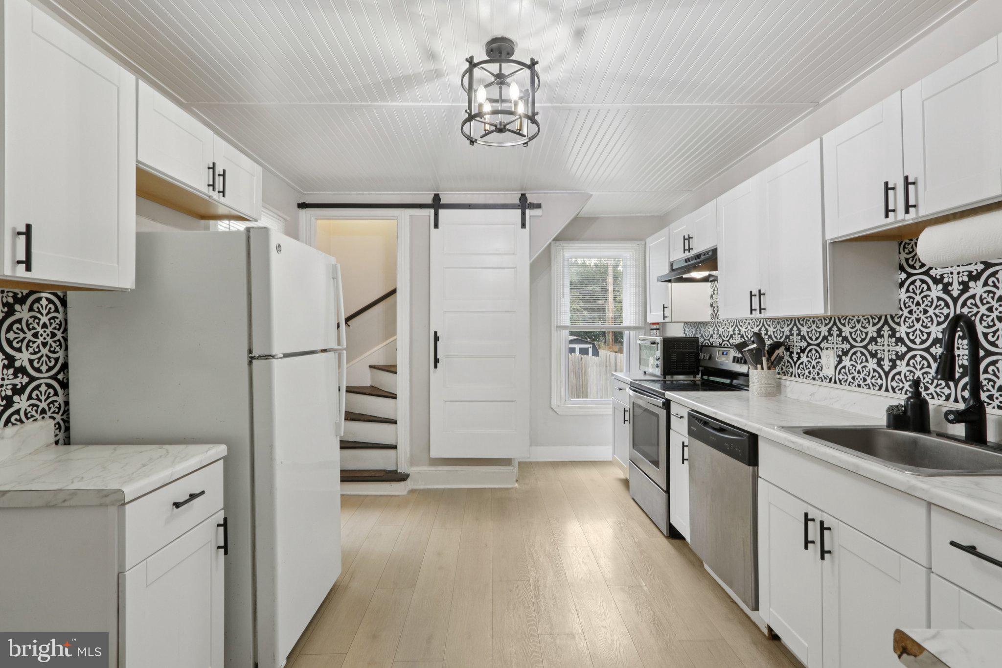 418 Walnut Street Pottstown, PA 19464 - Photo 8 of 52 a kitchen with cabinets and stainless steel appliances