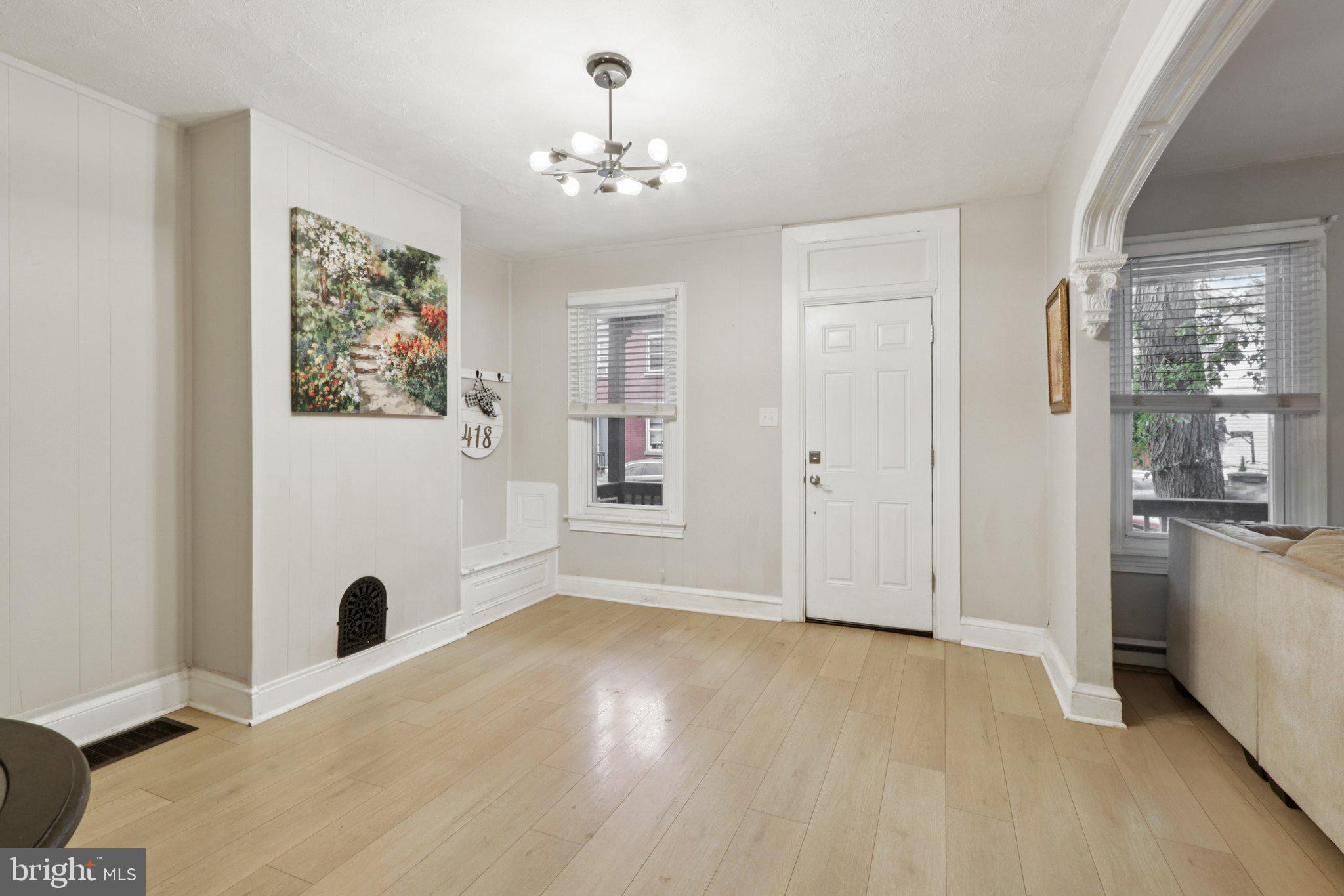 418 Walnut Street Pottstown, PA 19464 - Photo 10 of 52 a view of livingroom with hardwood floor and a ceiling fan