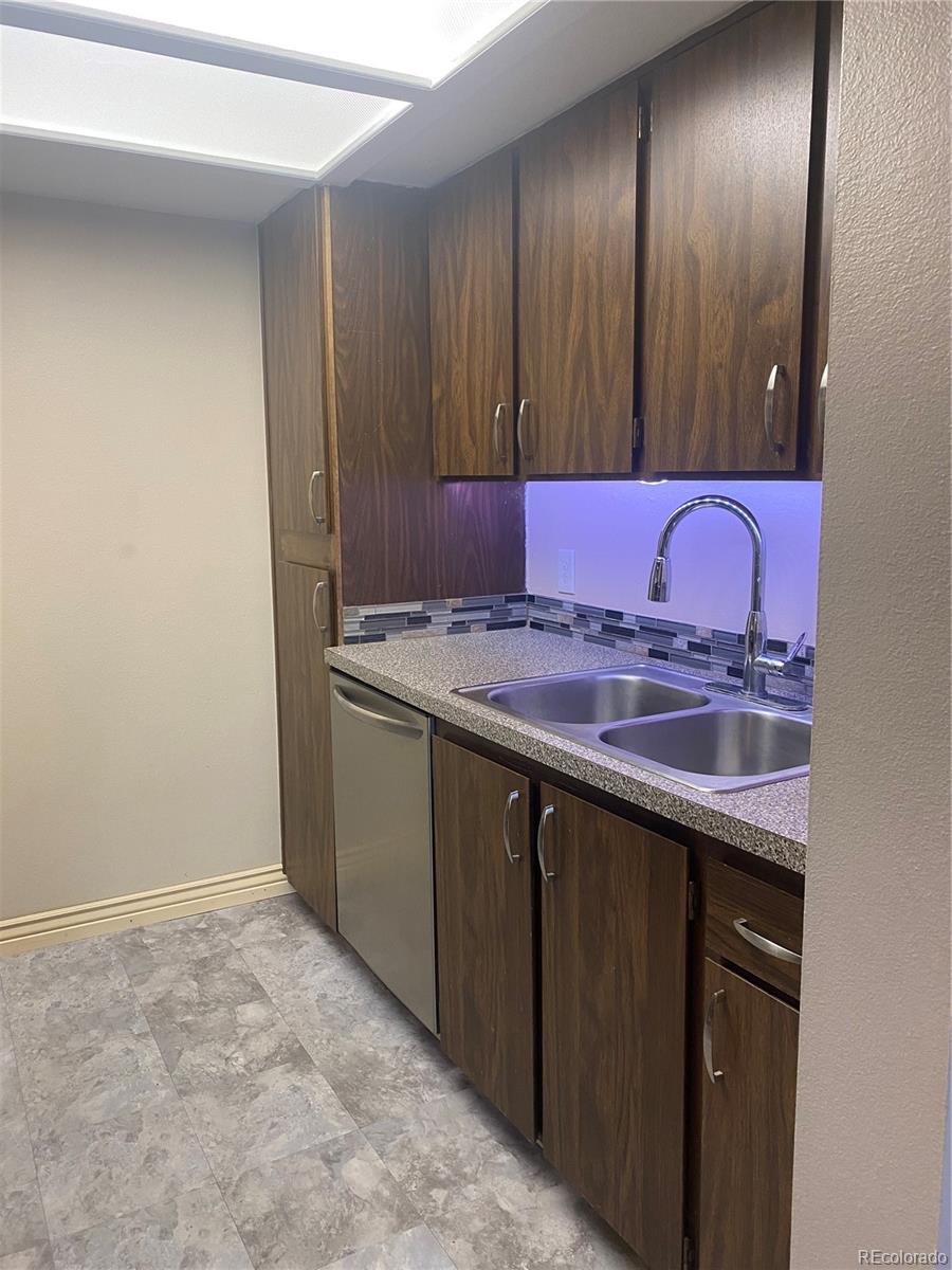 4671 South Decatur Street, Unit 232 Englewood, CO 80110 - Photo 11 of 32 a bathroom with a sink and a mirror