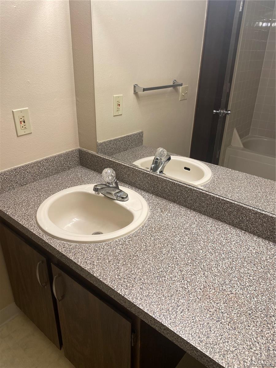4671 South Decatur Street, Unit 232 Englewood, CO 80110 - Photo 22 of 32 a bathroom with a sink and a mirror