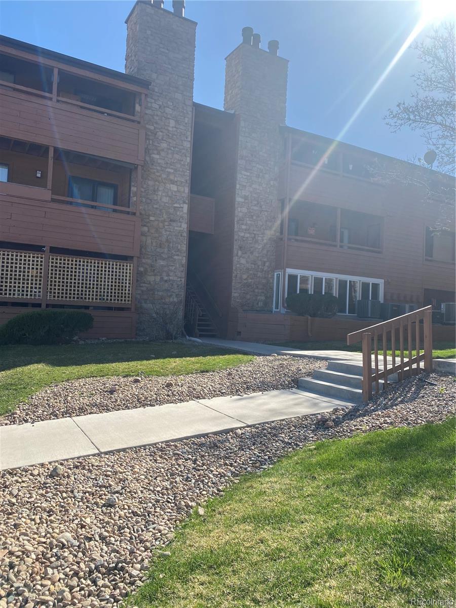 4671 South Decatur Street, Unit 232 Englewood, CO 80110 - Photo 28 of 32 a view of a pathway of a house with a garden