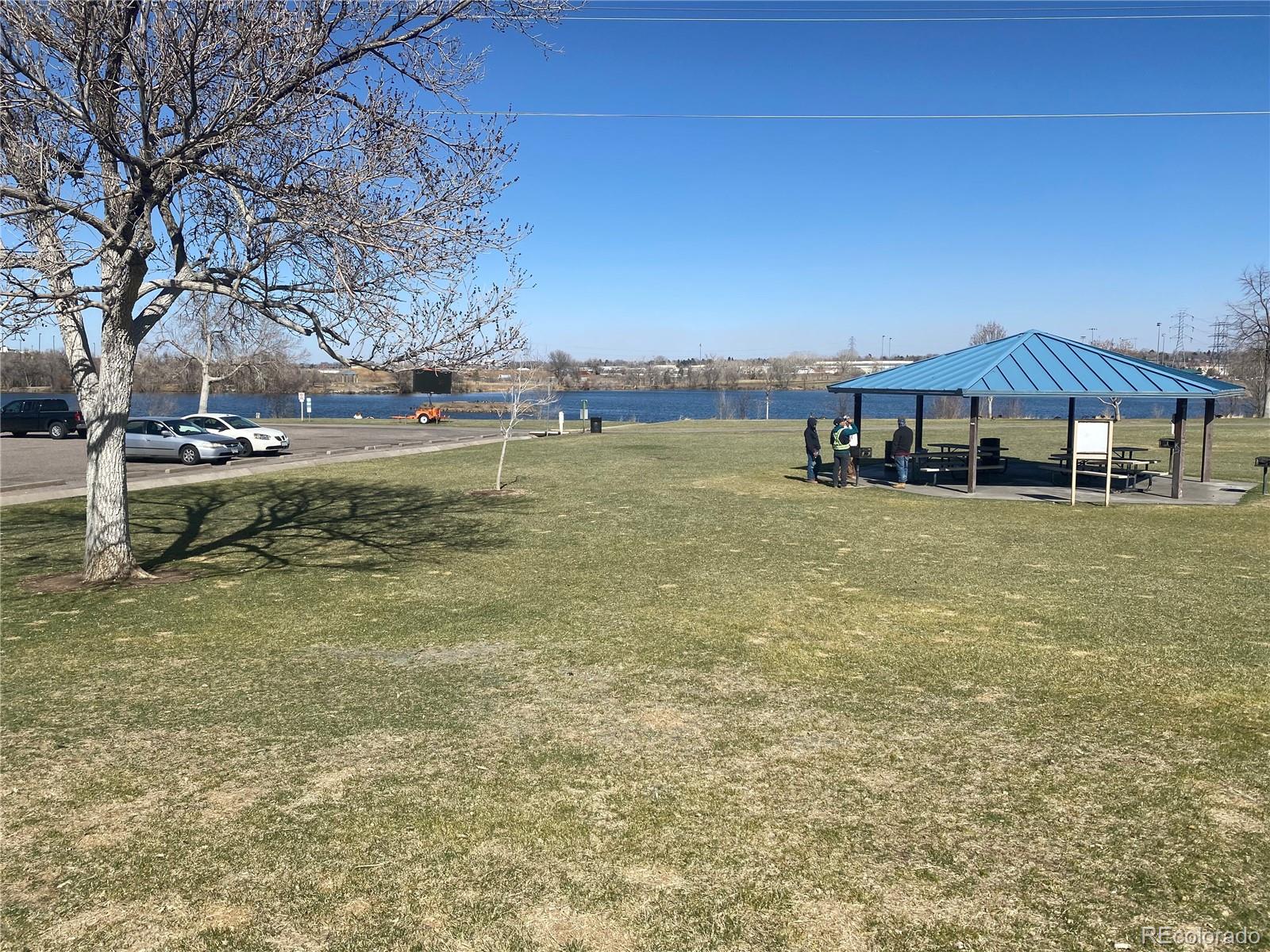 4671 South Decatur Street, Unit 232 Englewood, CO 80110 - Photo 30 of 32 a view of a lake with houses