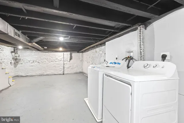 a utility room with dryer and washer