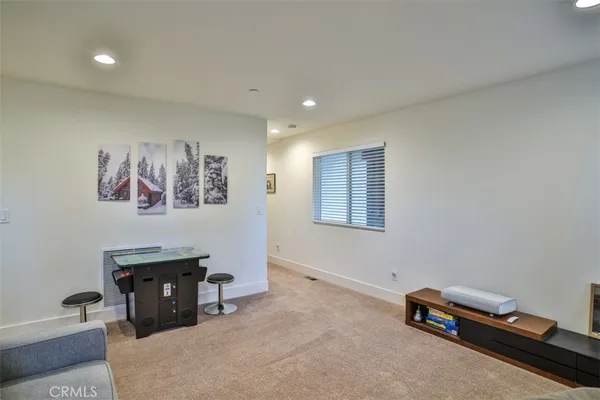 a view of a room with furniture and a window