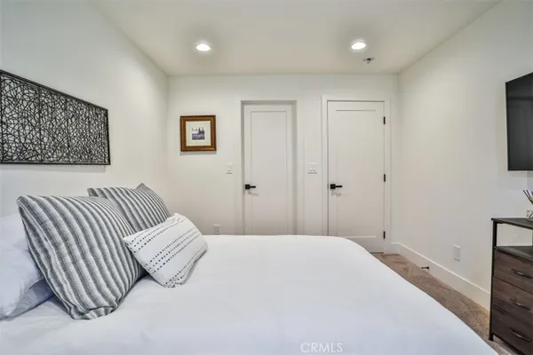 a bedroom with a bed and a couch