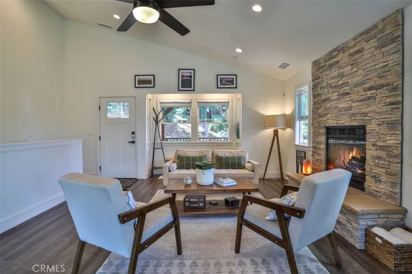 a living room with furniture and a fireplace