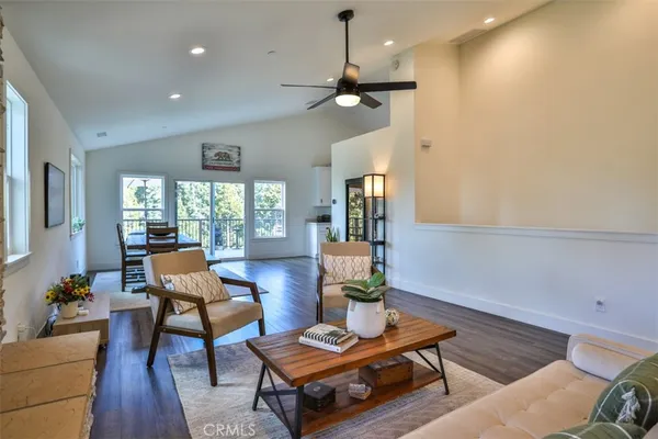 a living room with furniture and a potted plant