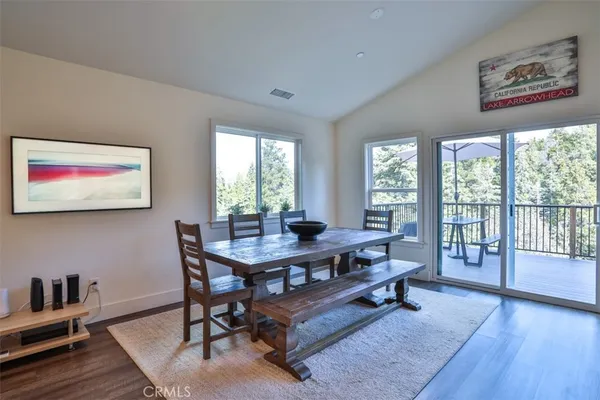 a view of a workspace with furniture window and wooden floor
