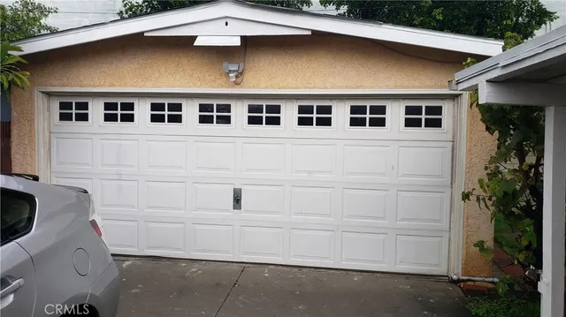 a front view of a house with garage