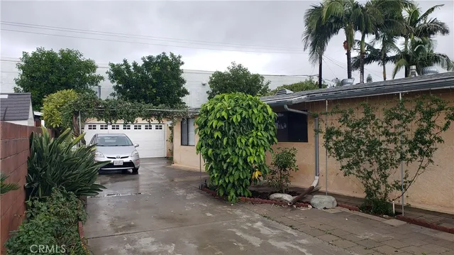 a view of a chair and table in the patio