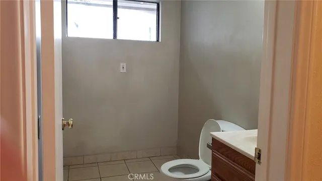 a bathroom with a granite countertop sink