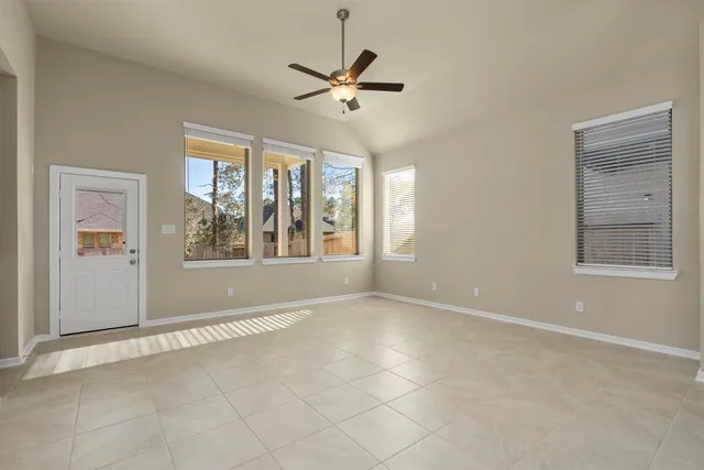 a view of an empty room with a window