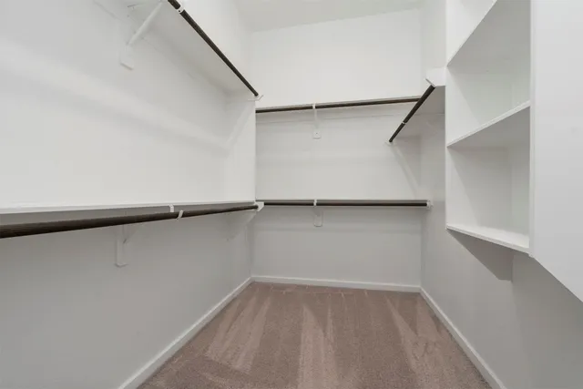 a view of an empty walk in closet