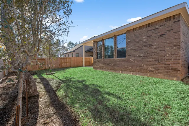 a backyard of a house with lots of green space