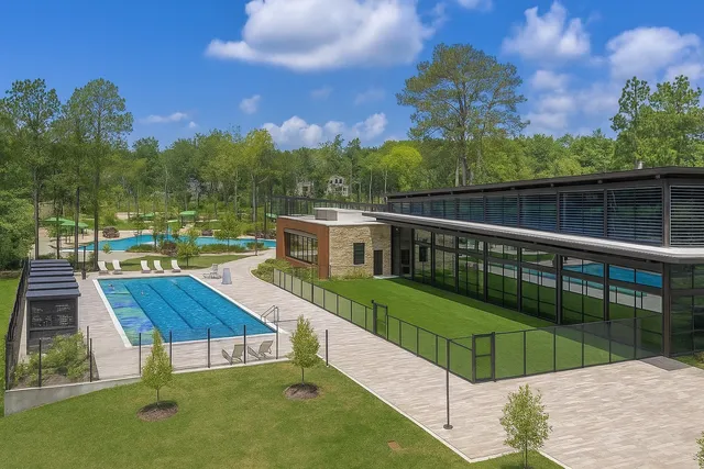 a view of a swimming pool with a patio