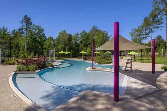 a view of a swimming pool with a patio