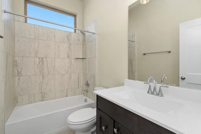 a bathroom with a sink a toilet and a bathtub