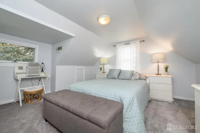 a bed room with a bed and a chair