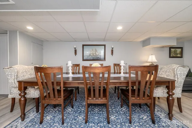 a view of a dining area with furniture and chandelier