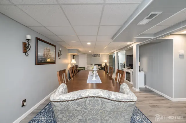 a view of a livingroom with furniture and staircase