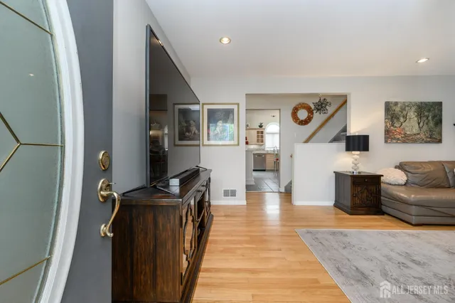 a living room with furniture and a rug