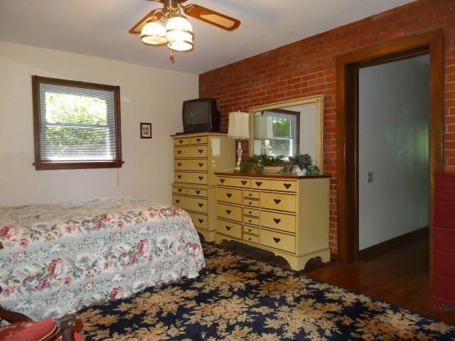 199 Old Oak Road Canonsburg, PA 15317 - Photo 13 of 21 Bed room with exposed brick wall and on suite. Great guest room!