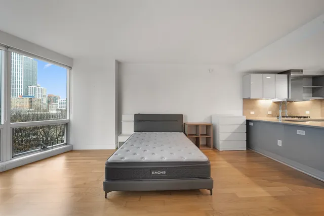 a living room with a couch and next to a window