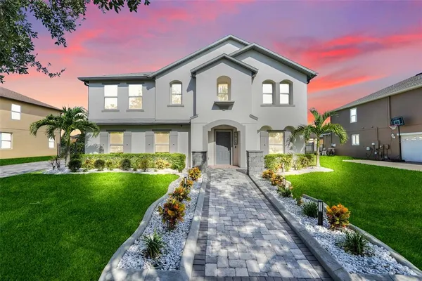 a front view of a house with a yard