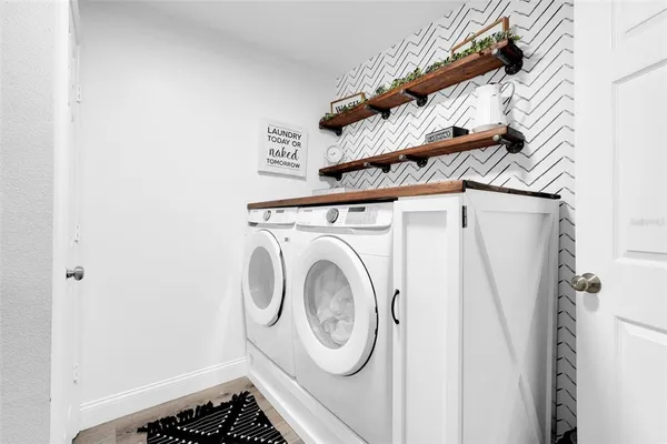 a utility room with dryer and washer