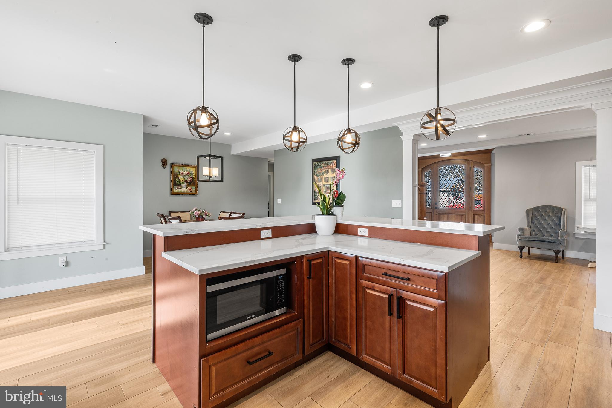118 Blough Road Fairless Hills, PA 19030 - Photo 11 of 37 a kitchen with stainless steel appliances granite countertop a sink a stove and a wooden floor