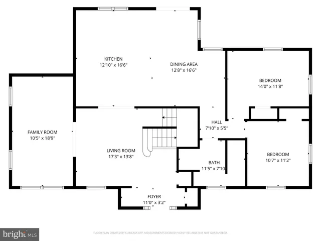 a picture of a bench in front of a wall