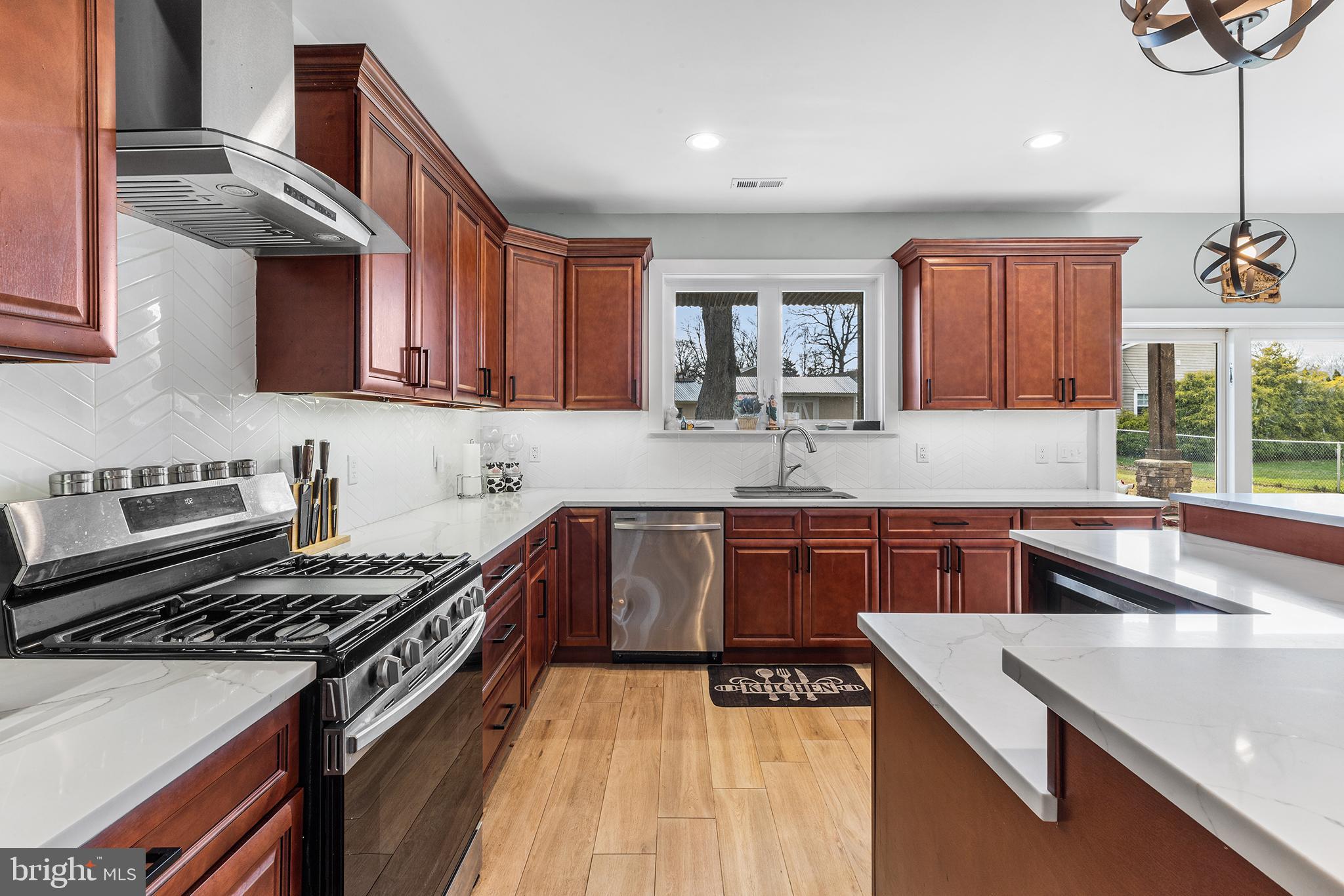 118 Blough Road Fairless Hills, PA 19030 - Photo 9 of 37 a kitchen with stainless steel appliances granite countertop a sink stove and refrigerator