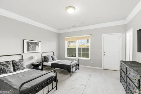 a bedroom with furniture and a window