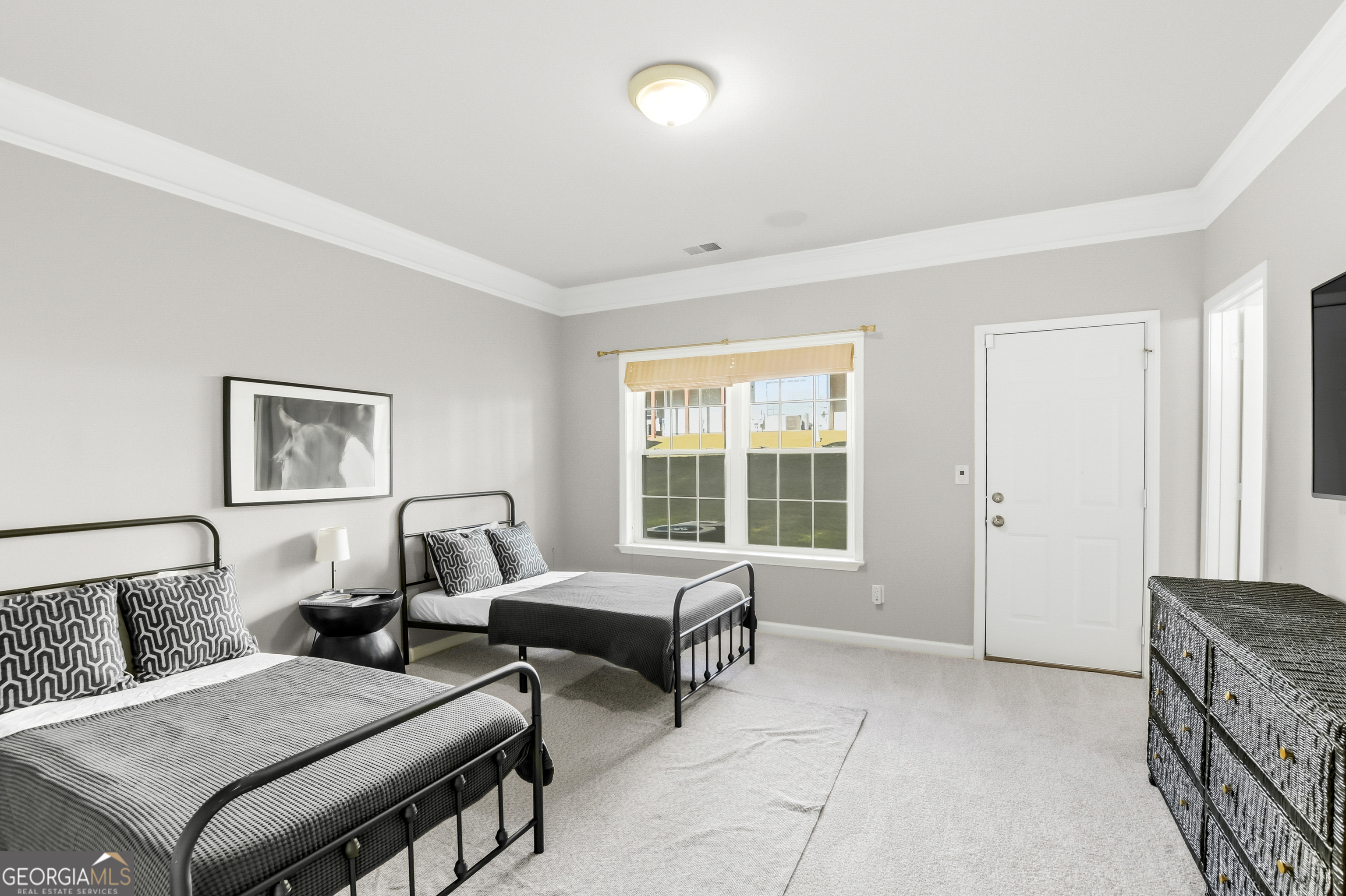 2205 Concordia Way Southeast, Unit 12 Smyrna, GA 30126 - Photo 21 of 25 a bedroom with furniture and a window