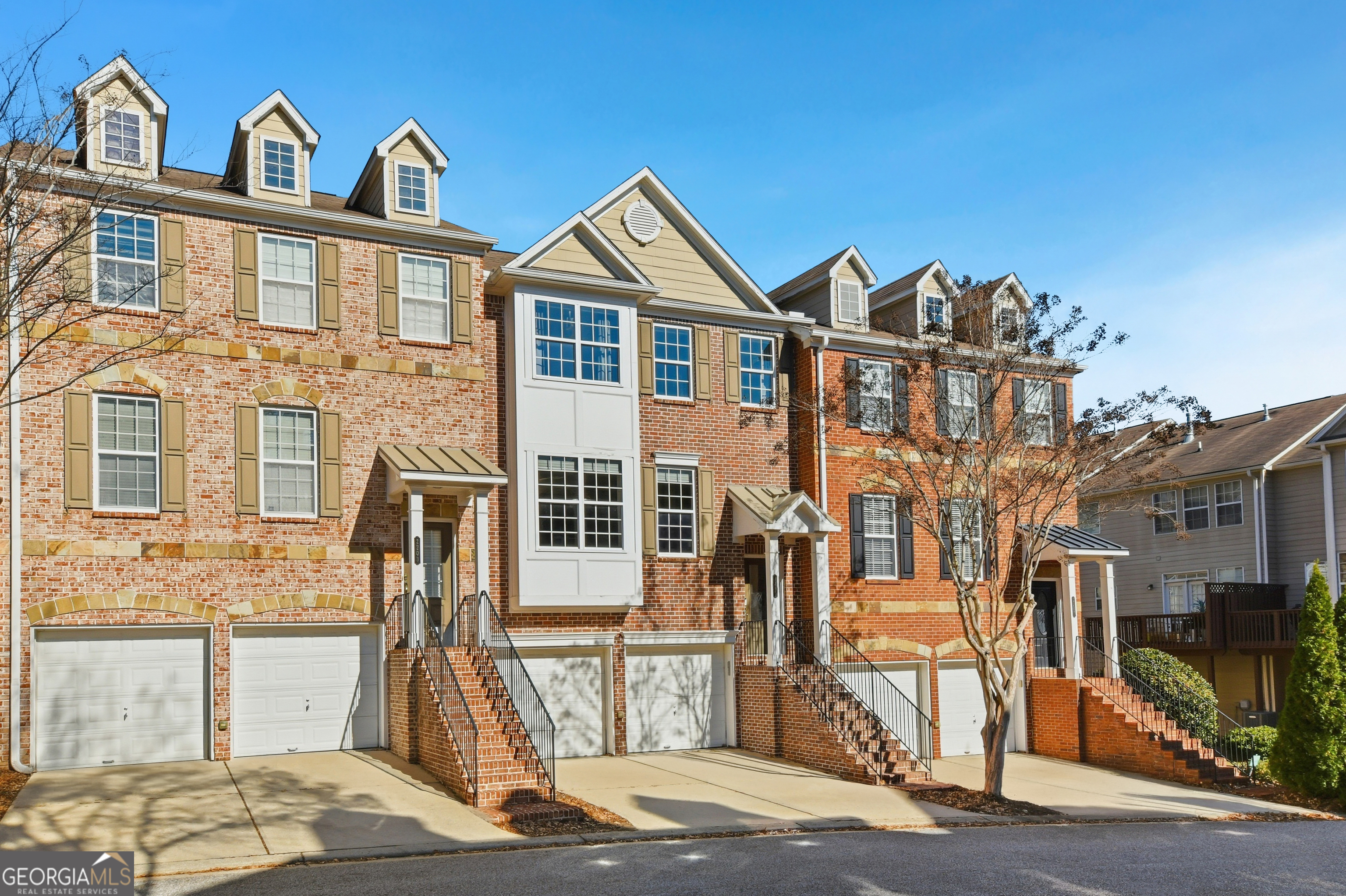 2205 Concordia Way Southeast, Unit 12 Smyrna, GA 30126 - Photo 23 of 25 a front view of a house with a yard