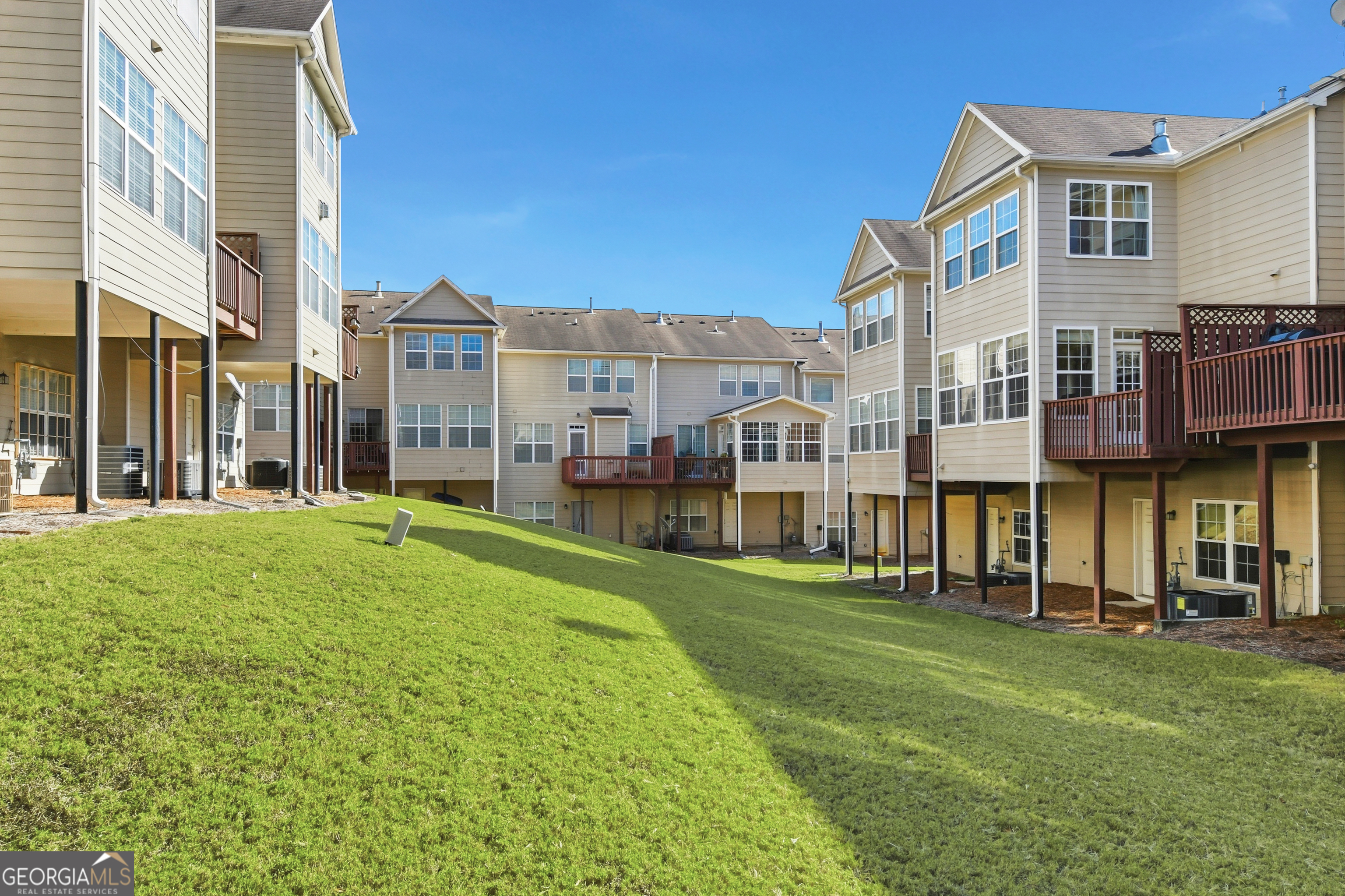 2205 Concordia Way Southeast, Unit 12 Smyrna, GA 30126 - Photo 24 of 25 a view of a building with a yard