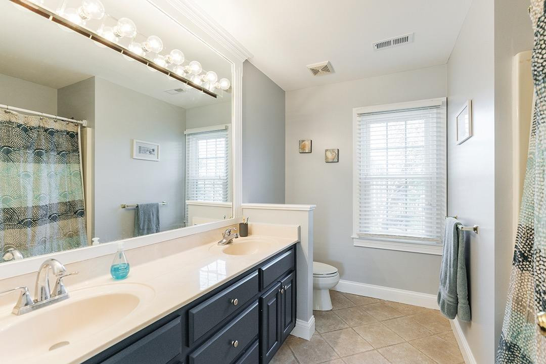 3320 Bridlington Road Lexington, KY 40509 - Photo 26 of 43 The hallway bathroom has dual vanities,