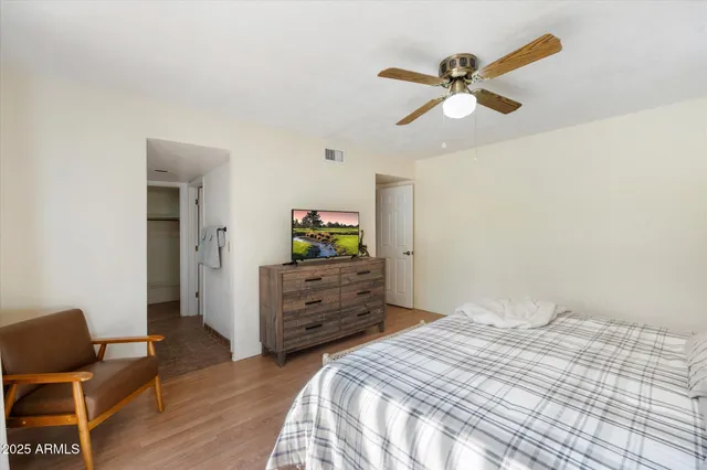 a bedroom with a bed and a dresser