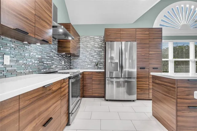 a kitchen with a refrigerator and a sink