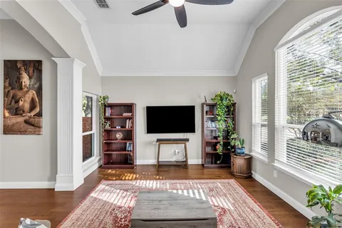 a view of a dining room with furniture and wooden floor