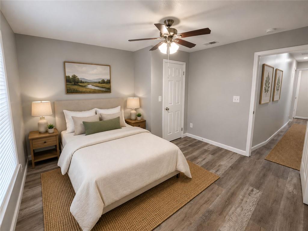 1280 Elizabeth Avenue Southwest Atlanta, GA 30310 - Photo 11 of 11 a bedroom with a bed and a chandelier