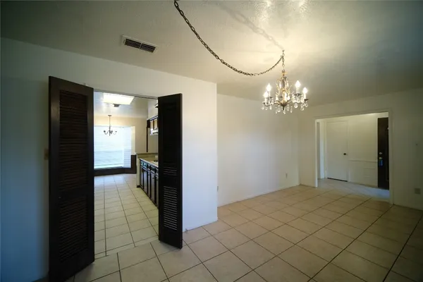 a kitchen with stainless steel appliances granite countertop a sink and a stove